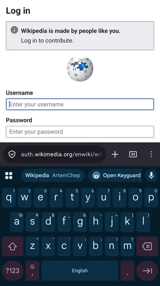 An inline autofill suggestion in the keyboard above a login form